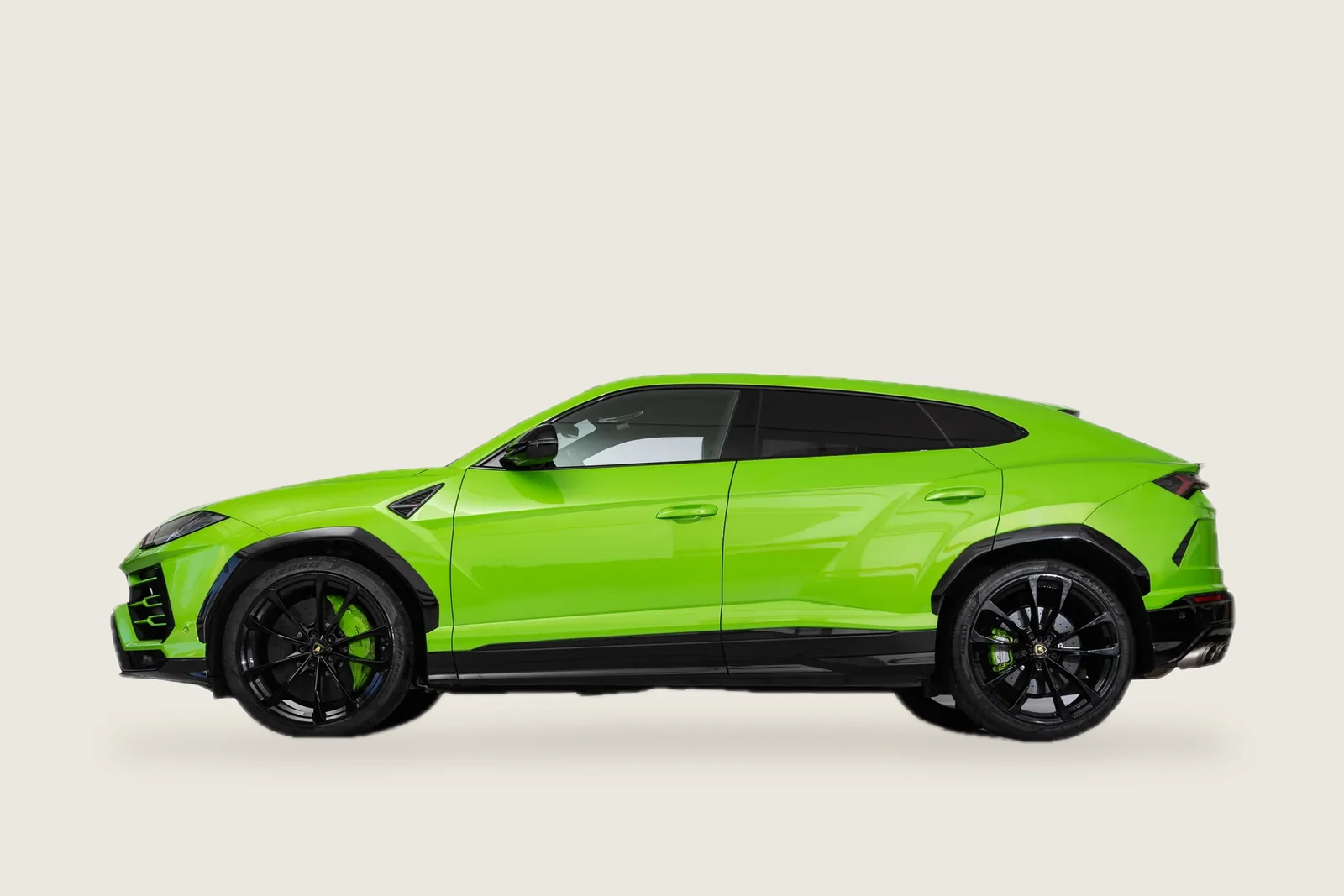Green Lamborghini Urus seen from the side