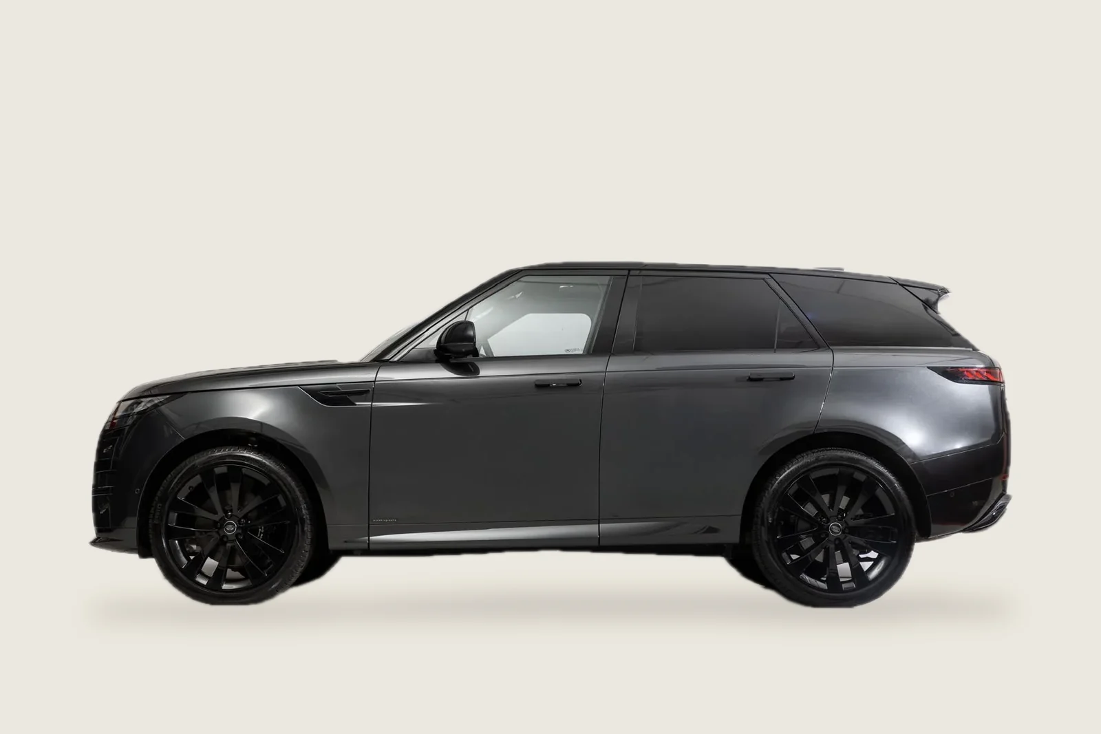 Dark grey Range Rover Sport seen from the side